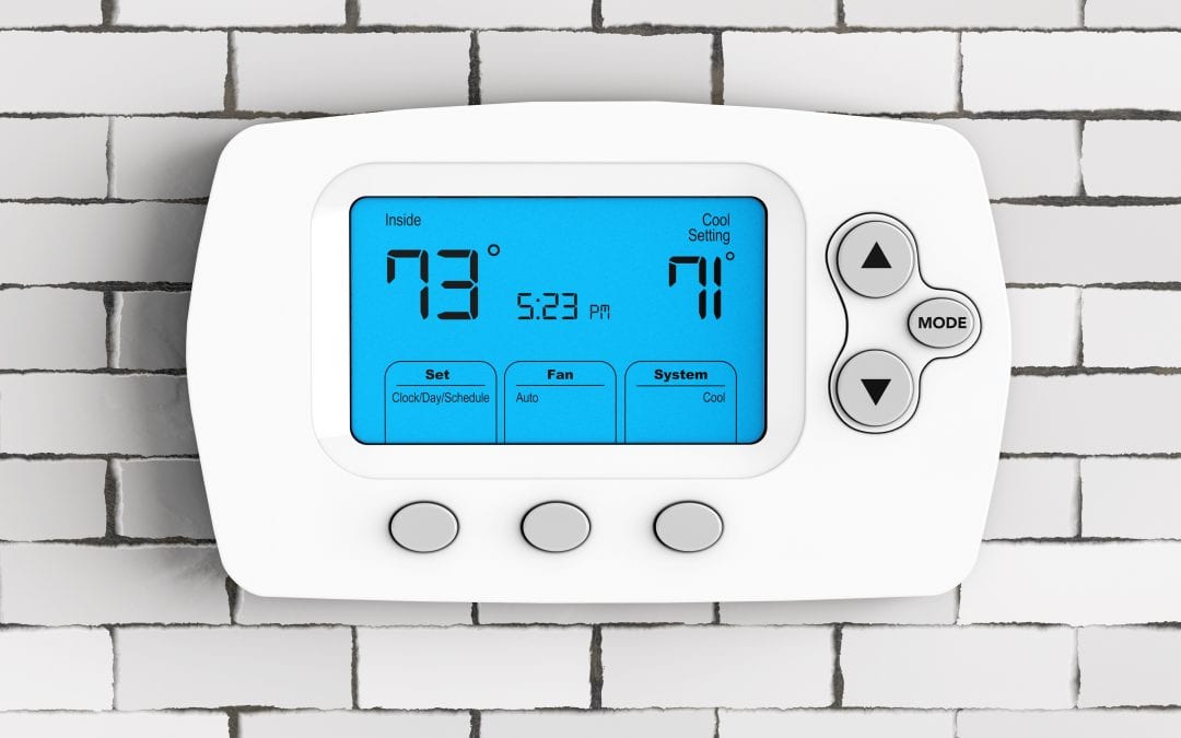 American Air Heating & Cooling | Rock Hill, SC | modern thermostat in brick wall