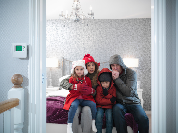 American Air Heating & Cooling | Rock Hill, SC | family wearing winter clothing in freezing house