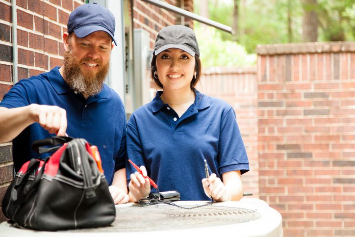 American Air Heating & Cooling | Rock Hill, SC | repairman working on home unit