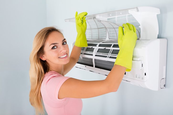 American Air Heating & Cooling | Rock Hill, SC | woman checking ac